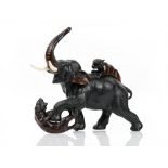 A Japanese bronze group of an elephant being attacked by two tigers, Meiji period, ivory tusks,