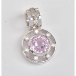 A kunzite and diamond pendant, collet set with the circular cut kunzite to the centre,