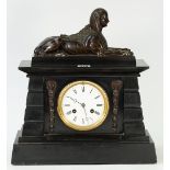 A French black slate mantel clock, surmounted by a bronze model of a sphinx, with a 4.