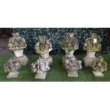 A set of four Vicenza stone finials moulded as flowers and fruit,