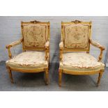 A pair of Louis XV style gilt framed square back open armchairs with bow seats on tapering fluted