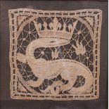 A pair of panels of lace depicting animals, 20cm square, and two others, all later framed (4).