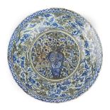 A large Safavid blue and black porcelain dish, first half 17th century,