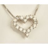 A white gold and diamond set pendant necklace, in an open heart shaped design,