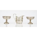 A George III silver helmet shaped milk jug, decorated with a reeded rim,