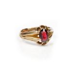 A 9ct gold ring, claw set with an oval cut garnet, Chester 1918, ring size T, gross weight 4.7 gms.