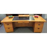 Peter James; from his study in West Sussex, a modern concave oak pedestal desk,