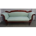 A George IV mahogany framed roll-end sofa, on turned supports, 210cm wide x 96cm high.