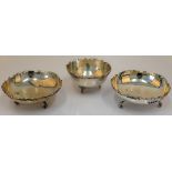 A pair of Egyptian circular dishes, each decorated with a cast scroll and pierced rim,