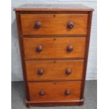A tall and narrow Victorian mahogany chest with four long graduated drawers on plinth base,