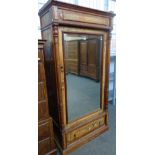 A North European pitch pine style mirrored door wardrobe with single drawer base,