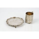 A silver card tray, of shaped circular form, having a piecrust rim in the Chippendale style,