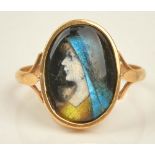 A French gold ring, mounted with an oval Limoges enamel, designed as the portrait of a lady,