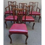A set of eight George III style mahogany dining chairs, with pierced splat on cabriole supports,