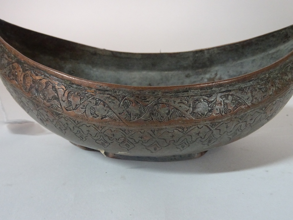 A Safavid tinned copper kachkol, possibly 18th century, of boat shape with ring handles, - Image 5 of 5