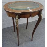 A late 19th century French gilt metal mounted mahogany oval bijouterie table,
