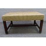 An 18th century and later rectangular footstool, on canted square mahogany supports,