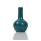 A small Chinese porcelain bottle vase, covered in a blue `robin's egg' glaze, 15.5cm high.