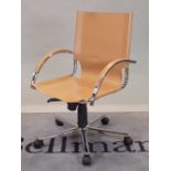 A modern tan leather and chrome office open armchair, 56cm wide x 89cm high.