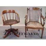 An early 20th century oak tub back office swivel chair, 82cm high,