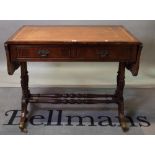 A Regency style mahogany two drawer sofa table on outswept supports, 94cm wide x 77cm high.