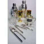 Silver plated wares including a modern cocktail shaker, 25cm high, another smaller, 22cm high,