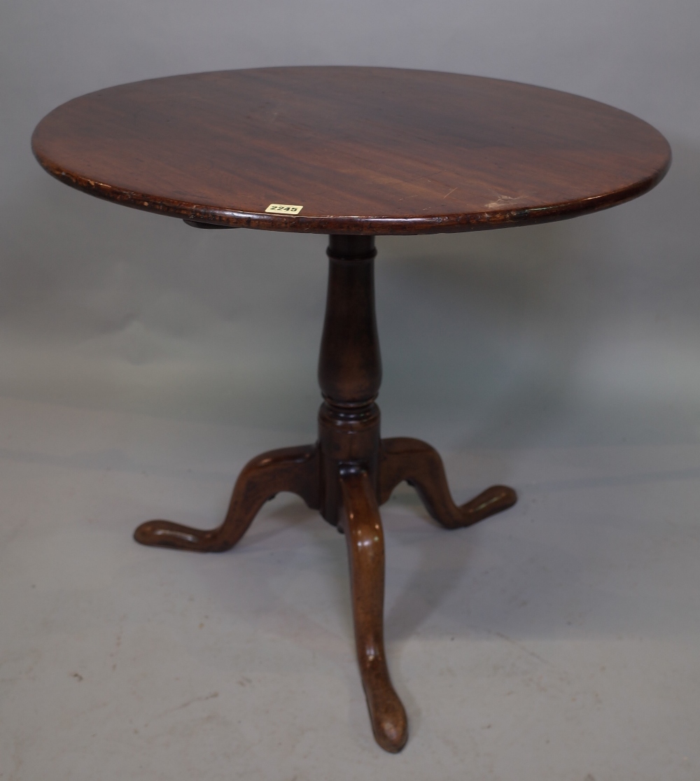 A 19th century mahogany circular tripod table, 87cm wide x 79cm high.