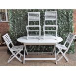 A white painted oval garden table on folding 'X' frame base, 150cm wide, with six folding chairs,