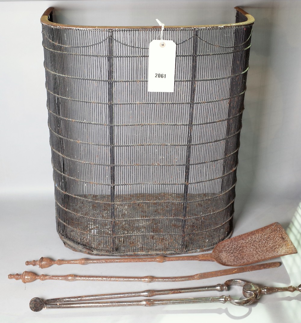 A 19th century nursery fender, 55cm wide and a group of three fire tools, (4).