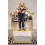 A modern gold painted arch top wall mirror, 58cm wide x 105cm high.