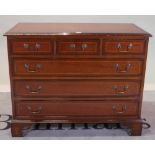 A 20th century mahogany chest of three short and three long drawers, on bracket feet,