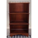 A mahogany three tier open waterfall bookcase on bracket feet, 65cm wide x 114cm high.