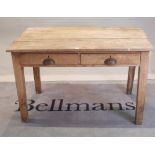 An early 20th century oak two drawer side table, on block supports,