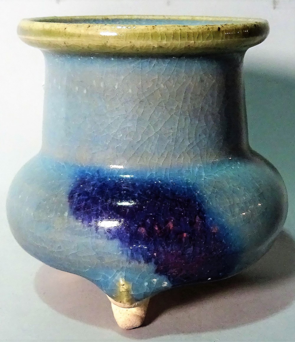 A small Jun type tripod vase, squat form with cylindrical neck and everted rim, 9.5cm. high.