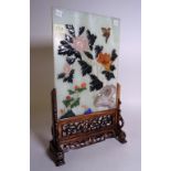 A modern Asian hardstone inlaid celadon panel, with carved stand, 28cm wide x 47cm high.