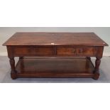 An 18th century style oak, two drawer coffee table, 122cm wide x 55cm high.