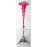 An early 20th century silver plated and ruby glass flower vase, 61cm high.