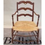 A late 19th century Continental elm and beech low ladderback open armchair, 60cm wide x 90cm high.