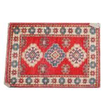 A Turkish mat, red field, 96cm x 67cm, and a Tekke Turkmen mat, 96cm x 53cm, (2).