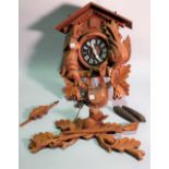A modern stained pine cuckoo clock, 44cm high, (a.f).