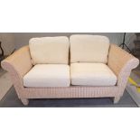 A wicker conservatory suite comprising; a sofa, 170cm wide x 70cm high, and two armchairs,