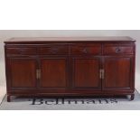 A modern Chinese hardwood sideboard with four drawers over cupboard base, 185cm wide x 90cm high.