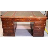An early 20th century stained beech pedestal desk, 115cm wide x 78cm high.