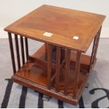 An Edwardian mahogany and satinwood banded revolving bookcase, 35cm wide x 35cm high.