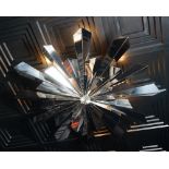 A contemporary chromium starburst light fitting, 120cm diameter.
