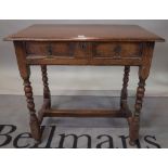 An 18th century style oak single drawer side table on bobbin turned supports, 79cm wide x 73cm high.