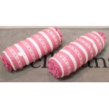 A pair of bolster cushions,