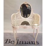 A Victorian style white painted dressing table, with oval mirror and canework decoration,