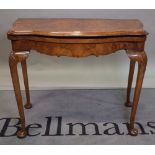 An 18th century style burr walnut demi-lune card table, 94cm wide x 76cm high.