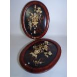 A pair of modern Asian oval wall plaques,